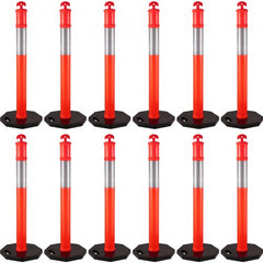 A pack of 12 red and white 44-inch traffic delineator posts with black rubber bases.