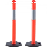 Two orange reflective traffic delineator posts with rubber bases and red arrow tops.