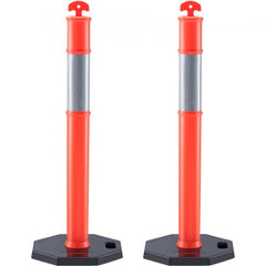 Two orange reflective traffic delineator posts with rubber bases and red arrow tops.