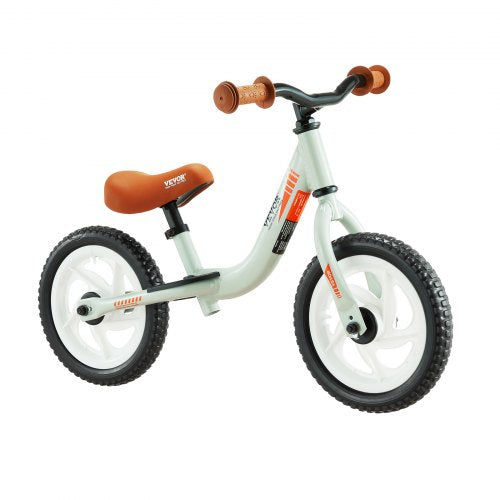 Light green 12-inch aluminum balance bike with adjustable seat, brown grips, and EVA foam tires.