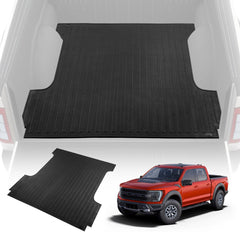 Black rubber truck bed mat for 2015-2023 Ford F-150 5.5ft short bed, shown installed in red truck.