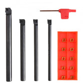 Four 1/4-inch indexable lathe turning tool holders with tin-coated carbide inserts and a wrench.