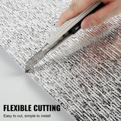 Hand cutting Bostome double reflective foam core radiant barrier roll with scissors.