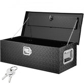 A black diamond plate aluminum truck bed tool box is shown open with two keys.