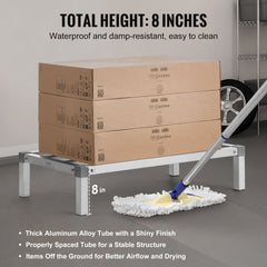 Aluminum dunnage rack with 8-inch height, supporting stacked boxes and a mop underneath.