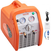 Portable 120V 1 HP dual-cylinder refrigerant recovery machine with orange handle, gauges, hoses, and accessories.