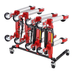 Red hydraulic car dolly rack with four slots, silver rollers, and swivel casters on black base.