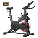 Indoor cycling bike with magnetic resistance, adjustable seat, and LCD display for tracking.
