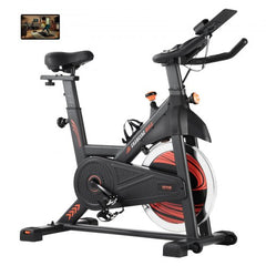 Indoor cycling bike with magnetic resistance, adjustable seat, and LCD display for tracking.