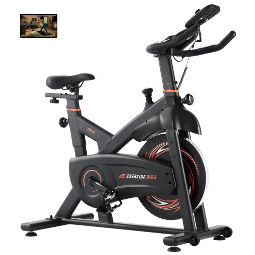 Indoor cycling bike with magnetic resistance, adjustable seat, and LCD display for tracking.