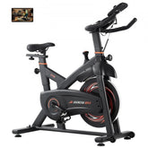 Indoor cycling bike with magnetic resistance, adjustable seat, and LCD display for tracking.