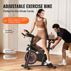 Indoor cycling exercise bike with magnetic resistance, adjustable seat, and handlebars.