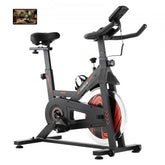 Indoor cycling bike with magnetic resistance, adjustable seat, and LCD display for tracking progress.