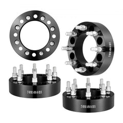 Black forged aluminum wheel spacers, 2-inch thickness, 8-lug, designed for Dodge and Ford trucks.