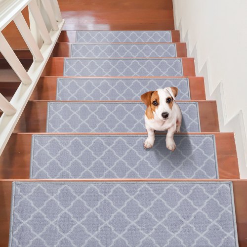 Light gray non-slip stair treads, 9"x28", with plush texture and velvet edges for safety.