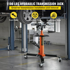 Orange steel hydraulic telescopic transmission jack with adjustable saddle and swivel casters.