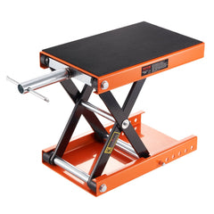 Orange Bostome 1100 lbs motorcycle scissor lift jack with wide rubber deck and safety pin.