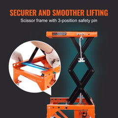 Orange hydraulic motorcycle lift table with scissor frame, safety pin, and wide deck on casters.