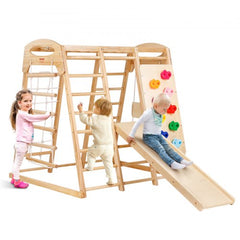 Wooden indoor jungle gym with ladders, climbing wall, slide, and toddlers playing.