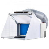 Portable airbrush spray booth with white hood, blue filter, LED lights, turntable, and exhaust hose.
