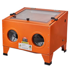 Orange steel sandblasting cabinet with transparent lid and dual gloves on a benchtop stand.