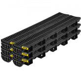 Bostome HDPE trench drain system with black plastic grates in a six-pack for outdoor drainage.
