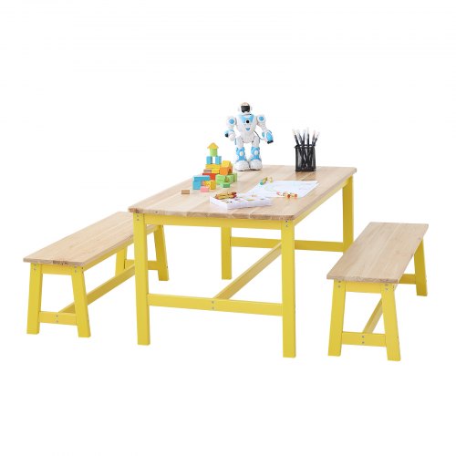 Yellow wooden kids table and two benches with robot toys and art supplies on top.