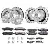 Set of drilled and slotted brake rotors with ceramic pads and hardware for Ram 1500 trucks.