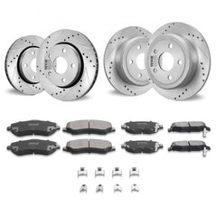 Four silver drilled and slotted brake rotors and eight black ceramic brake pads for Jeep Wrangler.