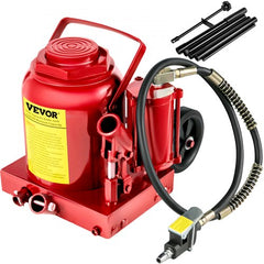 Red 50-ton air hydraulic bottle jack with heavy-duty steel construction, wheels, hose, and handle.