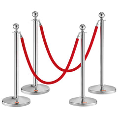 Four sturdy stainless steel stanchion posts with red velvet ropes for crowd control.