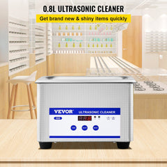 Bostome 0.8L 304 stainless steel ultrasonic cleaner with digital timer on wooden surface.