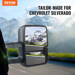 Black heated power-folding towing mirrors for Chevy Silverado, shown extended on truck with mountain view.