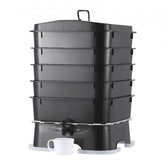 Black 5-tray 50L worm composter bin with tap and cup on white base.