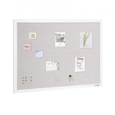 White linen surface bulletin board 48x36 inches with white frame and pinned notes and keys.