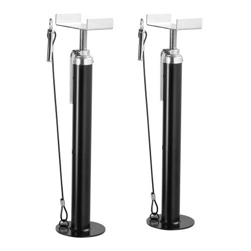 Two black adjustable RV slide-out support jacks with silver tops and pins.