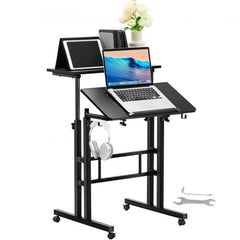 Height adjustable mobile standing desk with gas-spring mechanism and 360° swivel wheels.