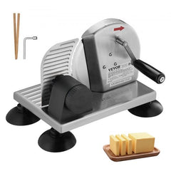 Silver manual adjustable bread and cheese slicer with crank handle, thickness dial, and sliced butter on wood board.