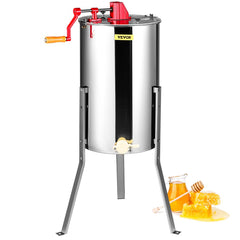 Stainless steel manual honey extractor with hand crank, stand, and honey frames.
