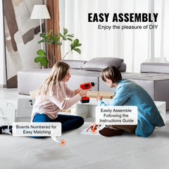 Two women assembling a white wall-mounted salon station with drawers and hair dryer holders.