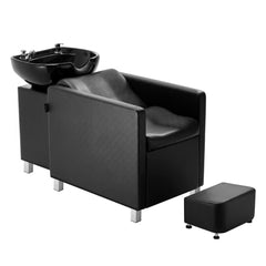 Black PU leather shampoo backwash chair with ceramic bowl and footrest.