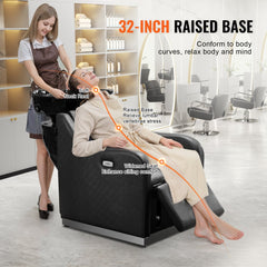 Black shampoo backwash chair with 32-inch raised base, electric footrest, and ceramic bowl.