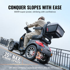 A man rides a black Bostome heavy-duty 4-wheel mobility scooter up a 25-degree incline, with 800W power and 178.4 lb load capacity.