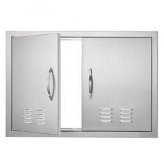 Stainless steel double BBQ access door with louvered vents and ergonomic handles, one door open.