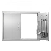 Stainless steel double BBQ access door with reversible panels and built-in utensil hooks.