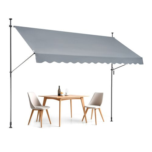 Gray retractable patio awning measuring 138x47 inches with a manual crank handle.