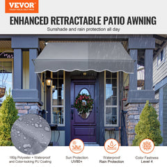 Gray 59x47-inch retractable patio awning with crank, mounted over a house door.
