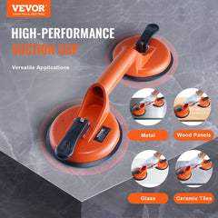Two orange 4.7-inch glass suction cups with aluminum handles, shown lifting glass, metal, wood, and ceramic surfaces.