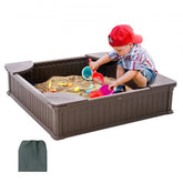 Brown square kids sandbox with cover, four corner seats, and durable HDPE construction.