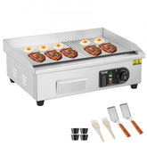 Stainless steel commercial electric griddle with half-flat, half-grooved 21x12in surface, eggs and steaks on grill, tongs and accessories included.